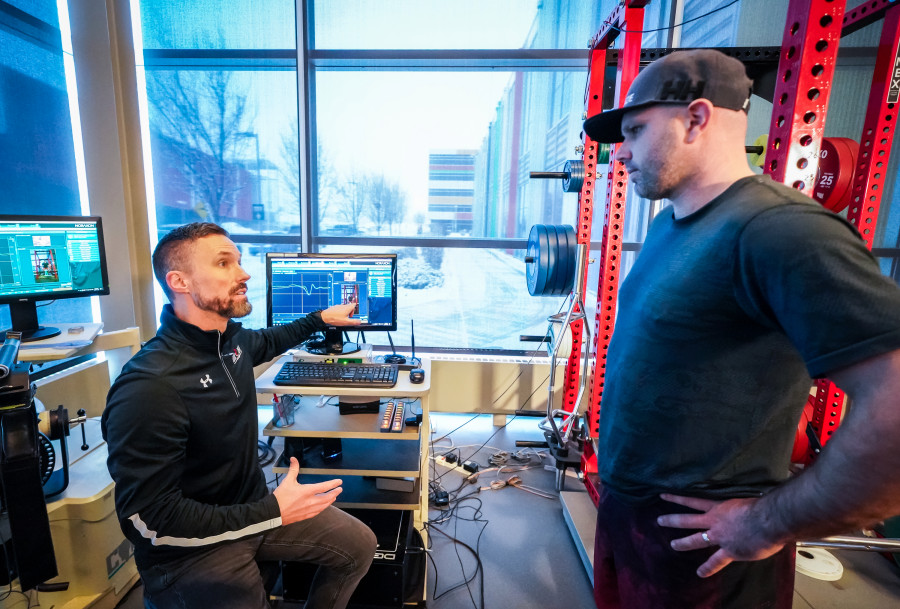 Matt Jordan, Director of Sport Science at the Canadian Sport Institute Calgary, is reviewing data collected on Olympian skier Manuel Osborne-Paradis during his rehabilitation of a lower leg injury. Photo: Courtesy of Dave Holland, Canadian Sport Institute Calgary.